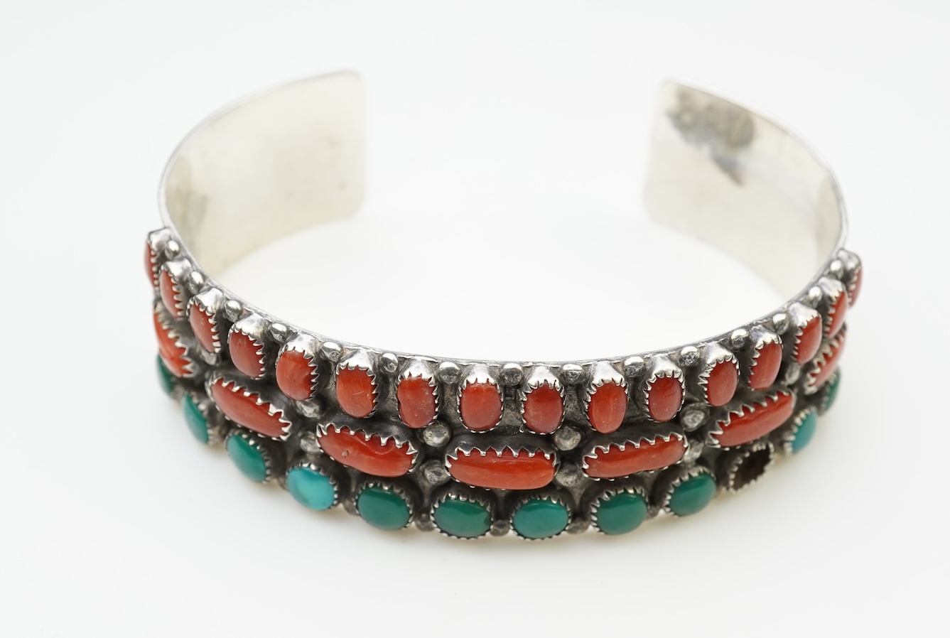 A collection of silver jewellery including a Zuni bangle